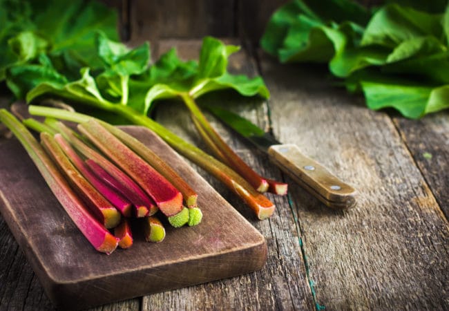 fresh organic rhubarb on cutting board, selective focus